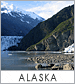 A picture of the alaska mountains and water.